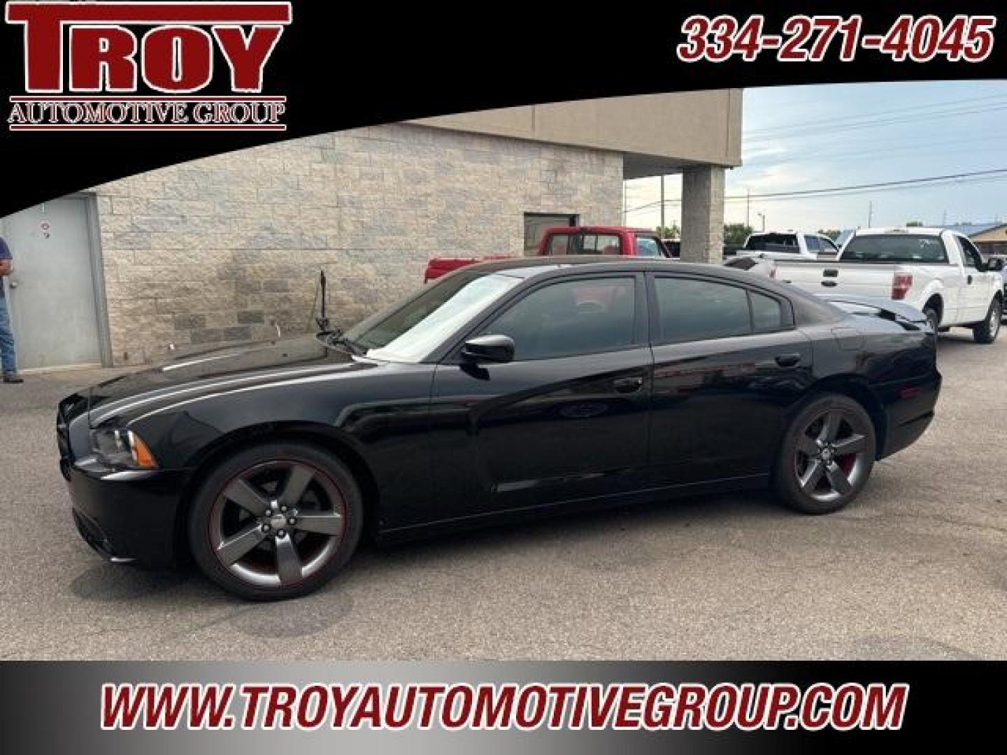 2014 Pitch Black /Black Dodge Charger SXT (2C3CDXHG9EH) with an 3.6L V6 24V VVT engine, Automatic transmission, located at 6812 Atlanta Hwy, Montgomery, AL, 36117, (334) 271-4045, 32.382118, -86.178673 - Red Line Package!!<br>Beats Sound System!! - Photo#0