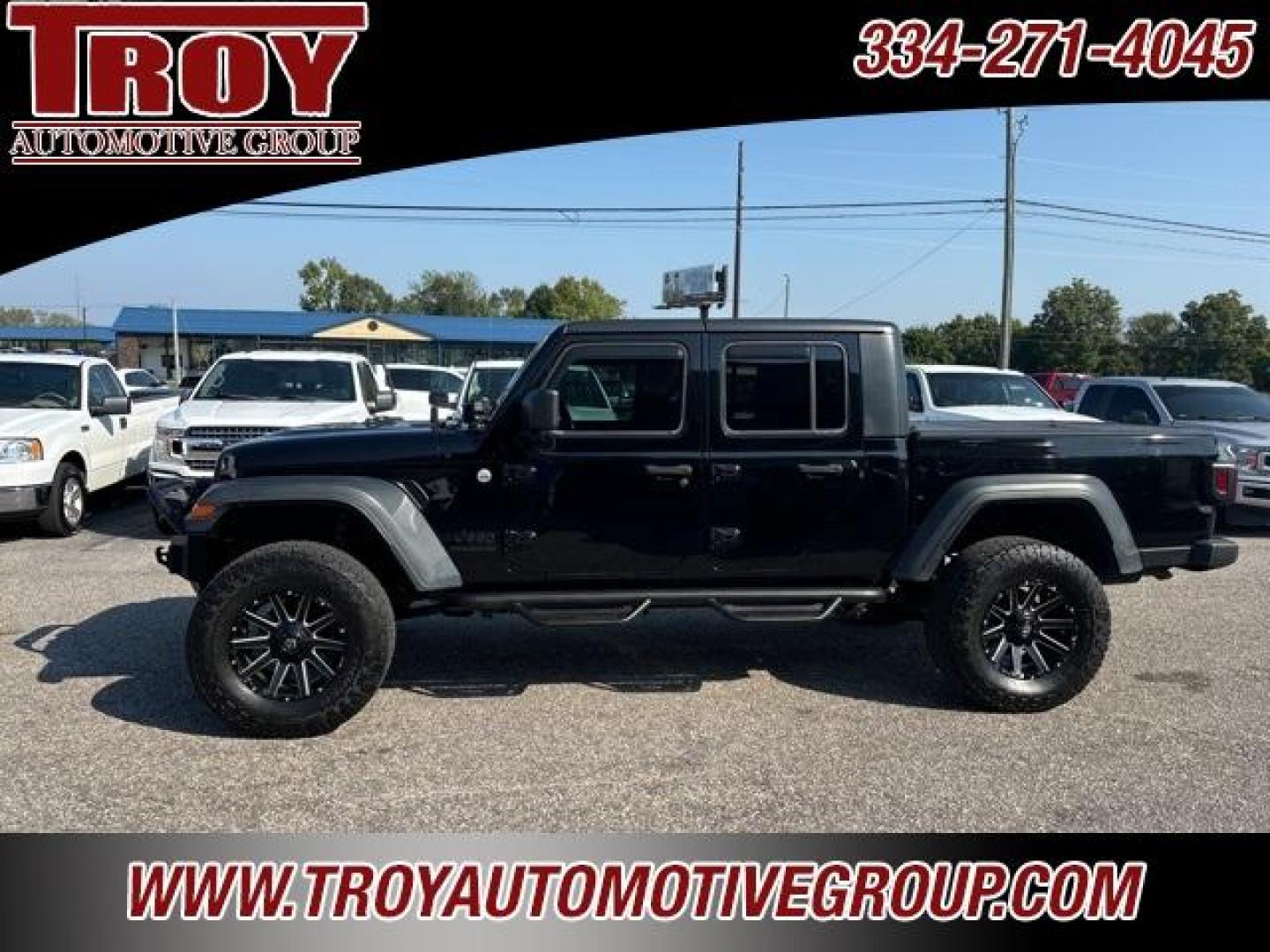 2020 Black Clearcoat /Black Jeep Gladiator Sport (1C6JJTAG4LL) with an 3.6L V6 24V VVT engine, Automatic transmission, located at 6812 Atlanta Hwy, Montgomery, AL, 36117, (334) 271-4045, 32.382118, -86.178673 - 1-Owner!!<br>Fox Lift Kit!!<br>Fuel Wheels w/35x12.50x18 cooper AT3 tires!!<br>Winch w/Synthetic Rope!! and Light Bar!!<br>Midland CB Radio!!<br>Stinger Custom Touch Screen Radio! ($700)!<br>Custom JL 10s w/JL Ampn<br>4 Cube Lights Hood Mounted!!<br>N Fab Step.Bars!<br>Rough Country Neoprene Seat - Photo#1