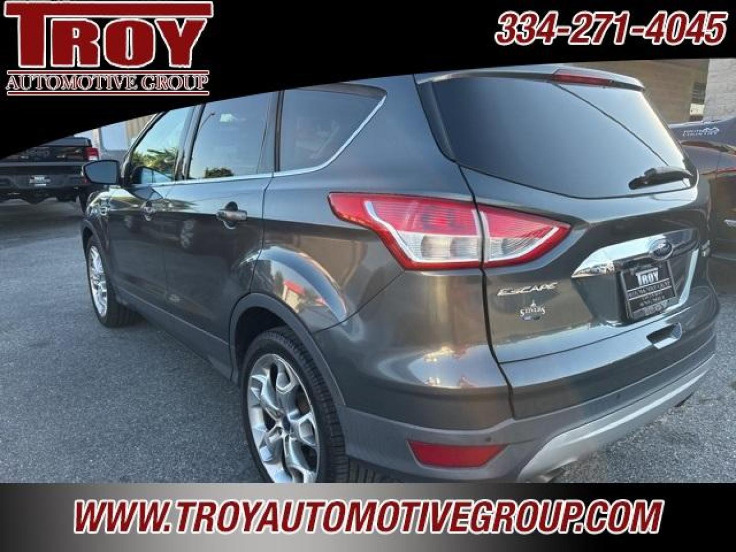 2015 Magnetic /Medium Light Stone Ford Escape Titanium (1FMCU0J91FU) with an EcoBoost 2.0L I4 GTDi DOHC Turbocharged VCT engine, Automatic transmission, located at 6812 Atlanta Hwy, Montgomery, AL, 36117, (334) 271-4045, 32.382118, -86.178673 - Photo#14