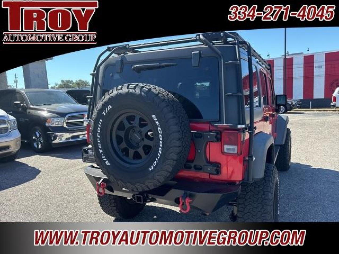 2015 Firecracker Red Clear Coat /Black Jeep Wrangler Unlimited Sport (1C4BJWDG8FL) with an 3.6L V6 24V VVT engine, Automatic transmission, located at 6812 Atlanta Hwy, Montgomery, AL, 36117, (334) 271-4045, 32.382118, -86.178673 - Fox Lift Kit!!<br>Warm Winch!!<br>Method Wheels w/BFG A/T Tires!! 35S with Full matching spare!!<br>GOBI Full Roof Rack!!<br>JW Speaker Headlights!<br>Bartact Front/Rear Seat Covers!!<br>Genesis Dual Battery Kit!! ($900)<br><br><br><br>Firecracker Red Clear Coat 2015 Jeep Wrangler Unlimited Sport 4W - Photo#10