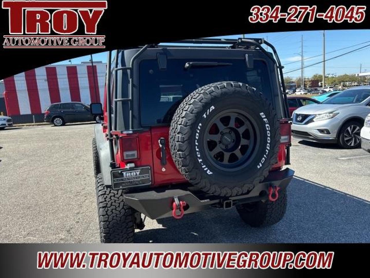 2015 Firecracker Red Clear Coat /Black Jeep Wrangler Unlimited Sport (1C4BJWDG8FL) with an 3.6L V6 24V VVT engine, Automatic transmission, located at 6812 Atlanta Hwy, Montgomery, AL, 36117, (334) 271-4045, 32.382118, -86.178673 - Fox Lift Kit!!<br>Warm Winch!!<br>Method Wheels w/BFG A/T Tires!! 35S with Full matching spare!!<br>GOBI Full Roof Rack!!<br>JW Speaker Headlights!<br>Bartact Front/Rear Seat Covers!!<br>Genesis Dual Battery Kit!! ($900)<br><br><br><br>Firecracker Red Clear Coat 2015 Jeep Wrangler Unlimited Sport 4W - Photo#11