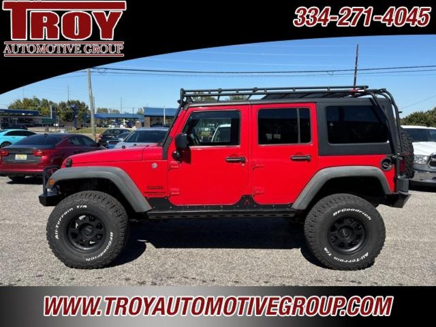 2015 Firecracker Red Clear Coat /Black Jeep Wrangler Unlimited Sport (1C4BJWDG8FL) with an 3.6L V6 24V VVT engine, Automatic transmission, located at 6812 Atlanta Hwy, Montgomery, AL, 36117, (334) 271-4045, 32.382118, -86.178673 - Fox Lift Kit!!<br>Warm Winch!!<br>Method Wheels w/BFG A/T Tires!! 35S with Full matching spare!!<br>GOBI Full Roof Rack!!<br>JW Speaker Headlights!<br>Bartact Front/Rear Seat Covers!!<br>Genesis Dual Battery Kit!! ($900)<br><br><br><br>Firecracker Red Clear Coat 2015 Jeep Wrangler Unlimited Sport 4W - Photo#14