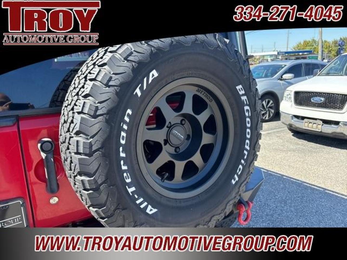 2015 Firecracker Red Clear Coat /Black Jeep Wrangler Unlimited Sport (1C4BJWDG8FL) with an 3.6L V6 24V VVT engine, Automatic transmission, located at 6812 Atlanta Hwy, Montgomery, AL, 36117, (334) 271-4045, 32.382118, -86.178673 - Fox Lift Kit!!<br>Warm Winch!!<br>Method Wheels w/BFG A/T Tires!! 35S with Full matching spare!!<br>GOBI Full Roof Rack!!<br>JW Speaker Headlights!<br>Bartact Front/Rear Seat Covers!!<br>Genesis Dual Battery Kit!! ($900)<br><br><br><br>Firecracker Red Clear Coat 2015 Jeep Wrangler Unlimited Sport 4W - Photo#17