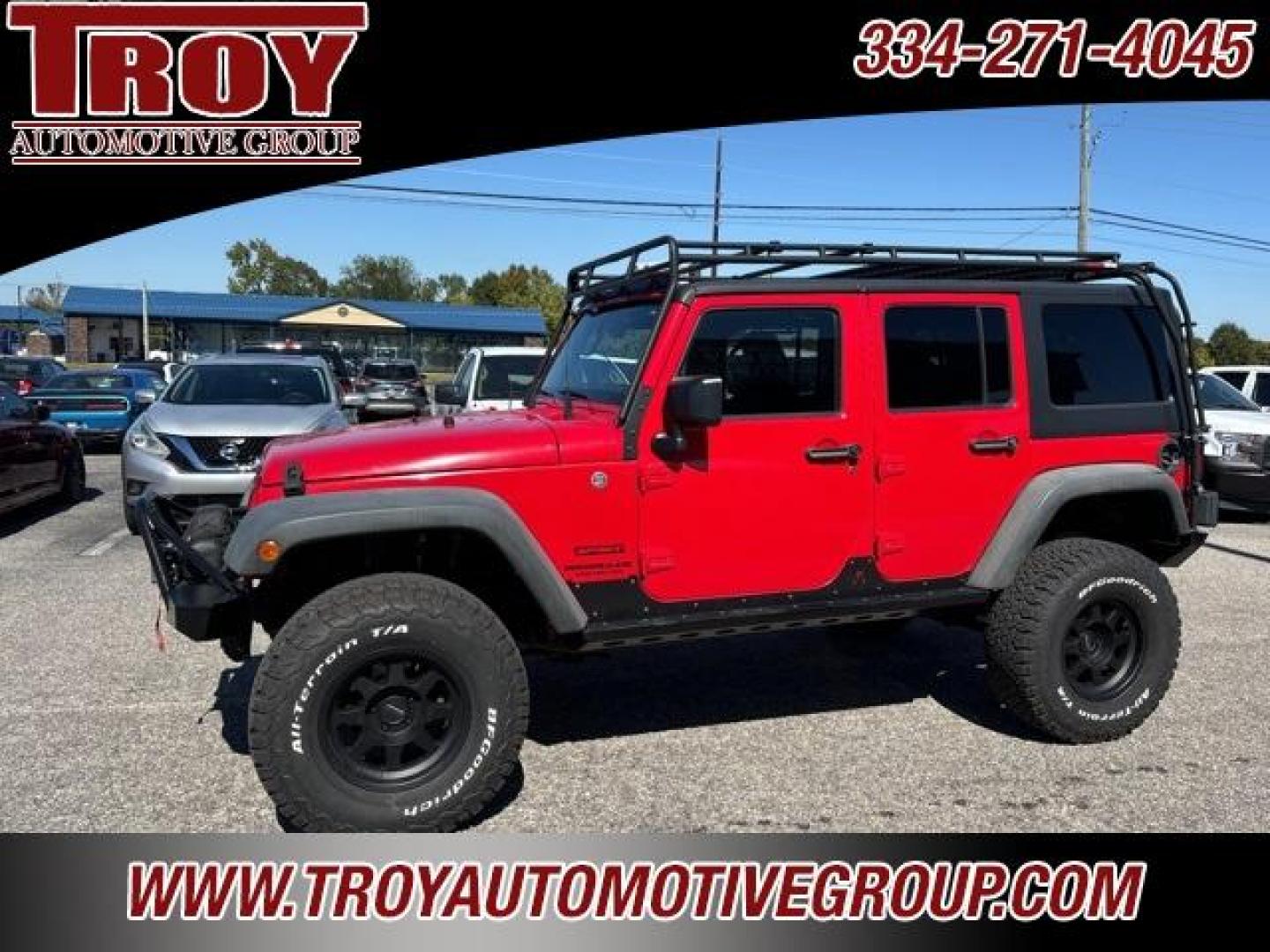 2015 Firecracker Red Clear Coat /Black Jeep Wrangler Unlimited Sport (1C4BJWDG8FL) with an 3.6L V6 24V VVT engine, Automatic transmission, located at 6812 Atlanta Hwy, Montgomery, AL, 36117, (334) 271-4045, 32.382118, -86.178673 - Fox Lift Kit!!<br>Warm Winch!!<br>Method Wheels w/BFG A/T Tires!! 35S with Full matching spare!!<br>GOBI Full Roof Rack!!<br>JW Speaker Headlights!<br>Bartact Front/Rear Seat Covers!!<br>Genesis Dual Battery Kit!! ($900)<br><br><br><br>Firecracker Red Clear Coat 2015 Jeep Wrangler Unlimited Sport 4W - Photo#1