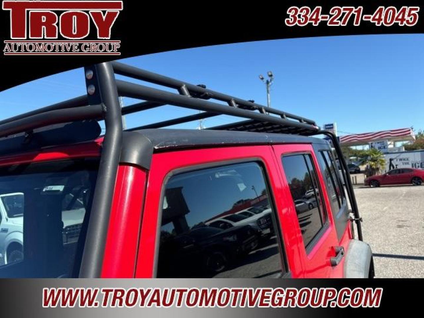 2015 Firecracker Red Clear Coat /Black Jeep Wrangler Unlimited Sport (1C4BJWDG8FL) with an 3.6L V6 24V VVT engine, Automatic transmission, located at 6812 Atlanta Hwy, Montgomery, AL, 36117, (334) 271-4045, 32.382118, -86.178673 - Fox Lift Kit!!<br>Warm Winch!!<br>Method Wheels w/BFG A/T Tires!! 35S with Full matching spare!!<br>GOBI Full Roof Rack!!<br>JW Speaker Headlights!<br>Bartact Front/Rear Seat Covers!!<br>Genesis Dual Battery Kit!! ($900)<br><br><br><br>Firecracker Red Clear Coat 2015 Jeep Wrangler Unlimited Sport 4W - Photo#26