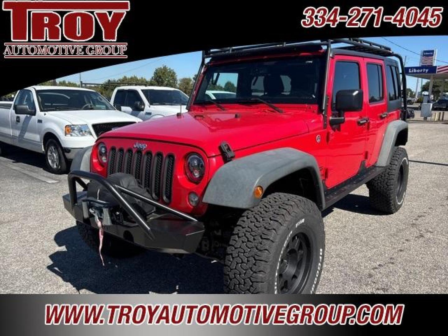 2015 Firecracker Red Clear Coat /Black Jeep Wrangler Unlimited Sport (1C4BJWDG8FL) with an 3.6L V6 24V VVT engine, Automatic transmission, located at 6812 Atlanta Hwy, Montgomery, AL, 36117, (334) 271-4045, 32.382118, -86.178673 - Fox Lift Kit!!<br>Warm Winch!!<br>Method Wheels w/BFG A/T Tires!! 35S with Full matching spare!!<br>GOBI Full Roof Rack!!<br>JW Speaker Headlights!<br>Bartact Front/Rear Seat Covers!!<br>Genesis Dual Battery Kit!! ($900)<br><br><br><br>Firecracker Red Clear Coat 2015 Jeep Wrangler Unlimited Sport 4W - Photo#3