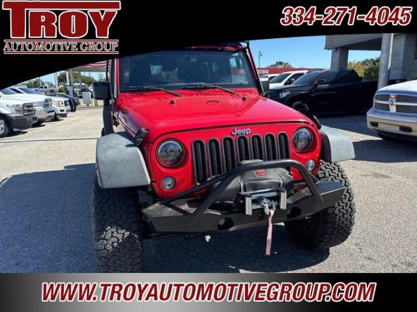 2015 Firecracker Red Clear Coat /Black Jeep Wrangler Unlimited Sport (1C4BJWDG8FL) with an 3.6L V6 24V VVT engine, Automatic transmission, located at 6812 Atlanta Hwy, Montgomery, AL, 36117, (334) 271-4045, 32.382118, -86.178673 - Fox Lift Kit!!<br>Warm Winch!!<br>Method Wheels w/BFG A/T Tires!! 35S with Full matching spare!!<br>GOBI Full Roof Rack!!<br>JW Speaker Headlights!<br>Bartact Front/Rear Seat Covers!!<br>Genesis Dual Battery Kit!! ($900)<br><br><br><br>Firecracker Red Clear Coat 2015 Jeep Wrangler Unlimited Sport 4W - Photo#5