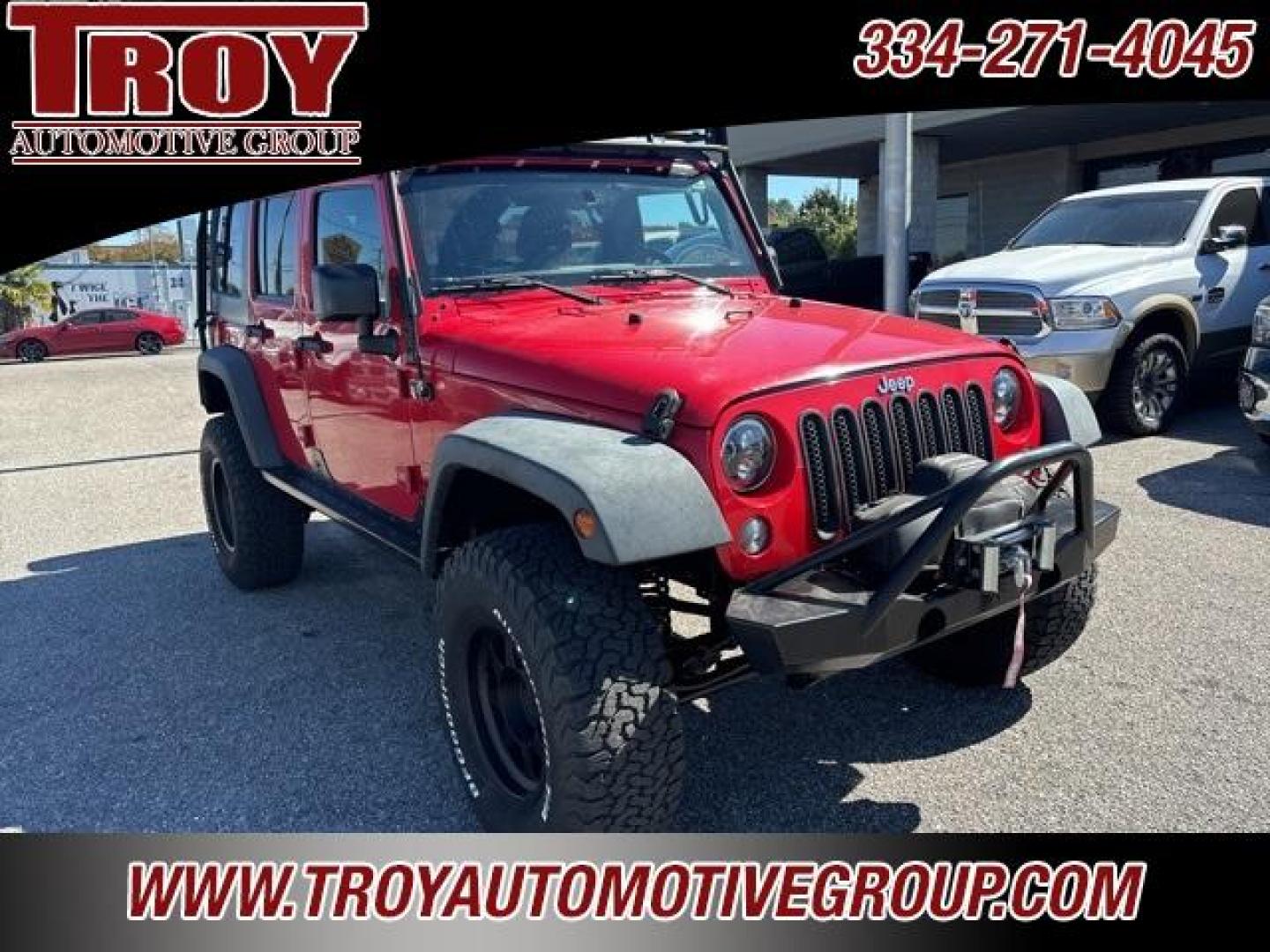 2015 Firecracker Red Clear Coat /Black Jeep Wrangler Unlimited Sport (1C4BJWDG8FL) with an 3.6L V6 24V VVT engine, Automatic transmission, located at 6812 Atlanta Hwy, Montgomery, AL, 36117, (334) 271-4045, 32.382118, -86.178673 - Fox Lift Kit!!<br>Warm Winch!!<br>Method Wheels w/BFG A/T Tires!! 35S with Full matching spare!!<br>GOBI Full Roof Rack!!<br>JW Speaker Headlights!<br>Bartact Front/Rear Seat Covers!!<br>Genesis Dual Battery Kit!! ($900)<br><br><br><br>Firecracker Red Clear Coat 2015 Jeep Wrangler Unlimited Sport 4W - Photo#6