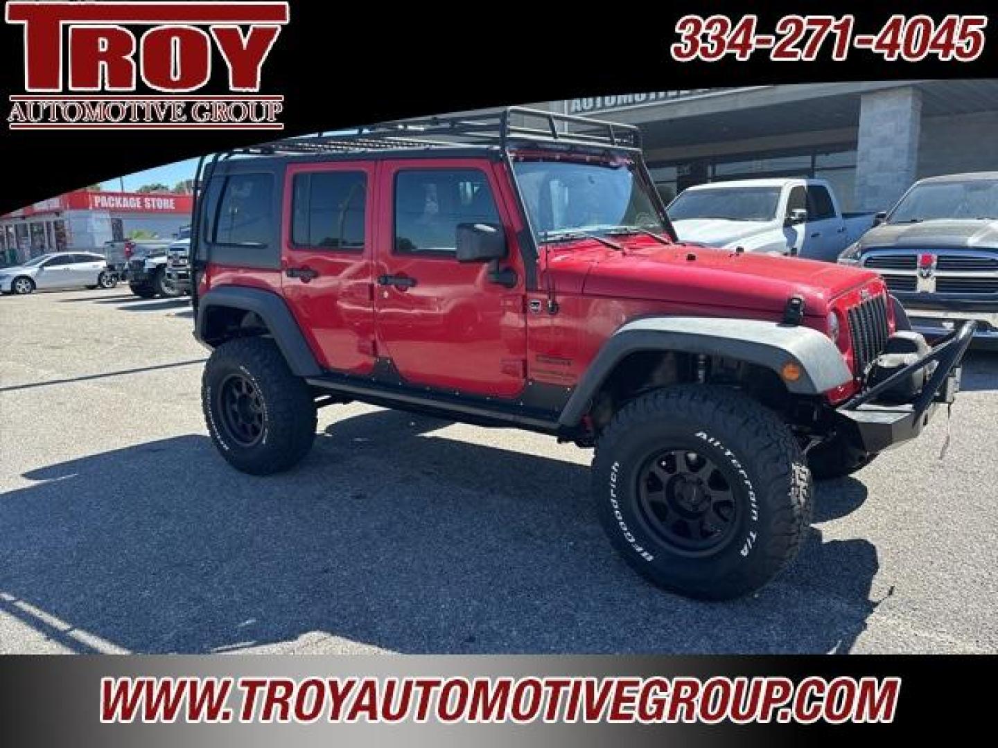 2015 Firecracker Red Clear Coat /Black Jeep Wrangler Unlimited Sport (1C4BJWDG8FL) with an 3.6L V6 24V VVT engine, Automatic transmission, located at 6812 Atlanta Hwy, Montgomery, AL, 36117, (334) 271-4045, 32.382118, -86.178673 - Fox Lift Kit!!<br>Warm Winch!!<br>Method Wheels w/BFG A/T Tires!! 35S with Full matching spare!!<br>GOBI Full Roof Rack!!<br>JW Speaker Headlights!<br>Bartact Front/Rear Seat Covers!!<br>Genesis Dual Battery Kit!! ($900)<br><br><br><br>Firecracker Red Clear Coat 2015 Jeep Wrangler Unlimited Sport 4W - Photo#7