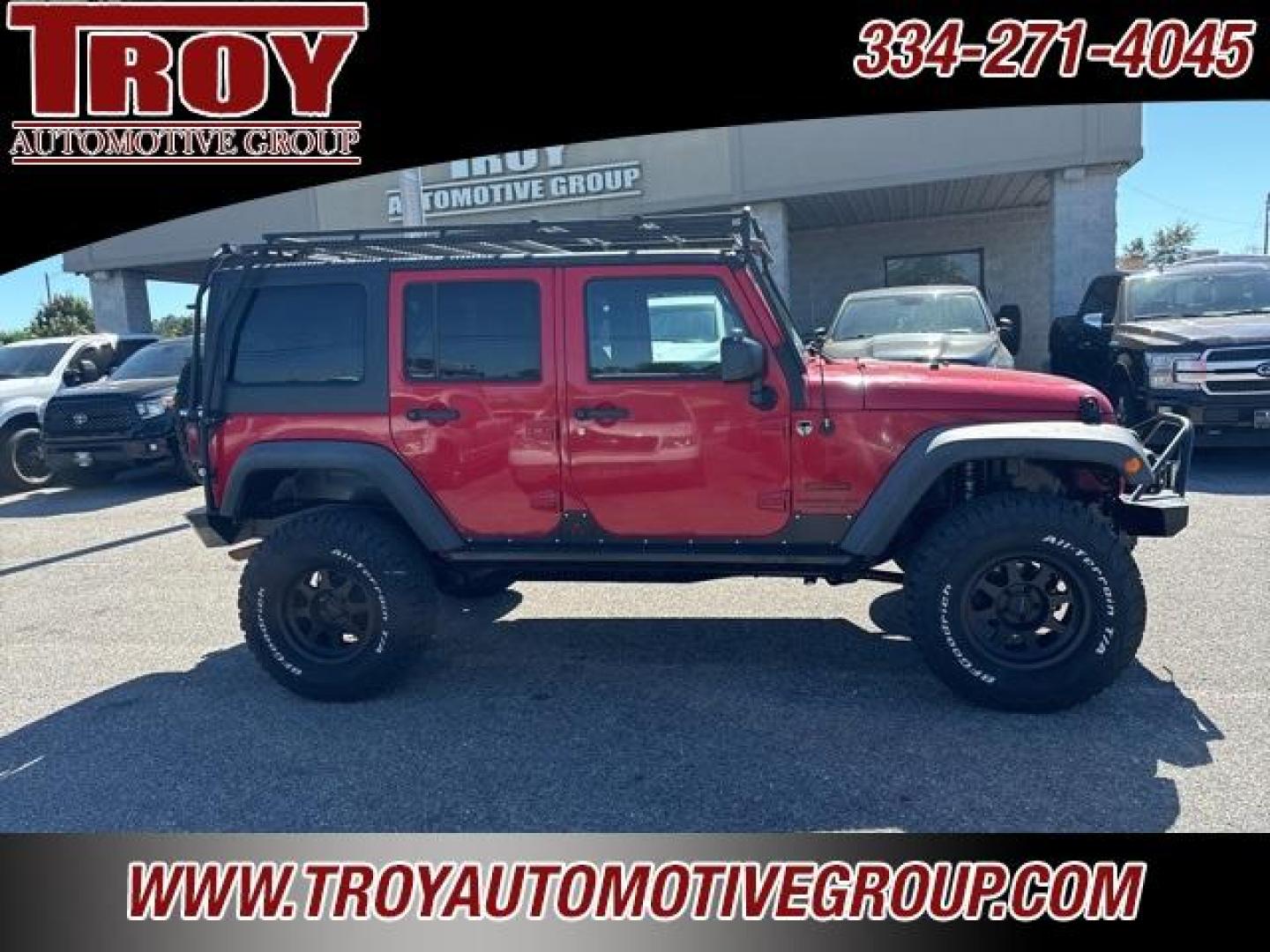 2015 Firecracker Red Clear Coat /Black Jeep Wrangler Unlimited Sport (1C4BJWDG8FL) with an 3.6L V6 24V VVT engine, Automatic transmission, located at 6812 Atlanta Hwy, Montgomery, AL, 36117, (334) 271-4045, 32.382118, -86.178673 - Fox Lift Kit!!<br>Warm Winch!!<br>Method Wheels w/BFG A/T Tires!! 35S with Full matching spare!!<br>GOBI Full Roof Rack!!<br>JW Speaker Headlights!<br>Bartact Front/Rear Seat Covers!!<br>Genesis Dual Battery Kit!! ($900)<br><br><br><br>Firecracker Red Clear Coat 2015 Jeep Wrangler Unlimited Sport 4W - Photo#8